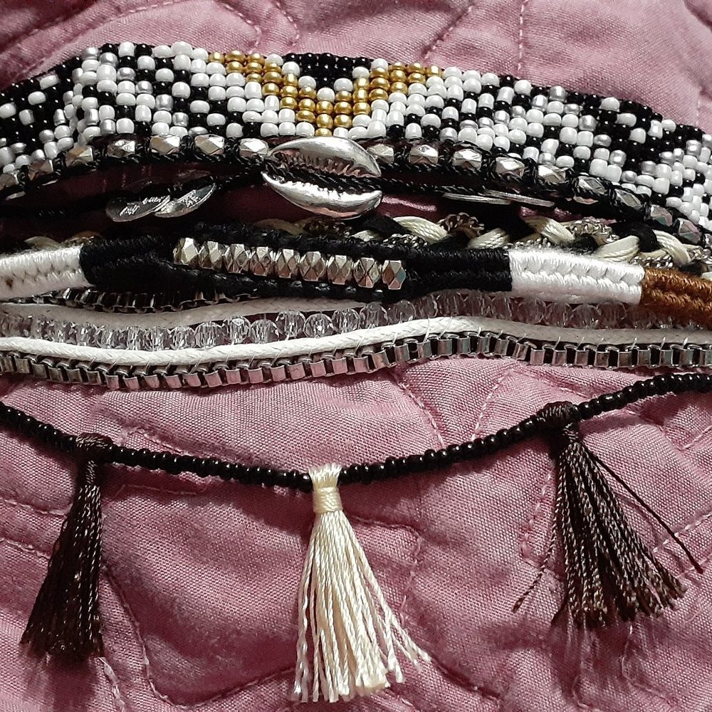 Layered beaded bracelet with tassels